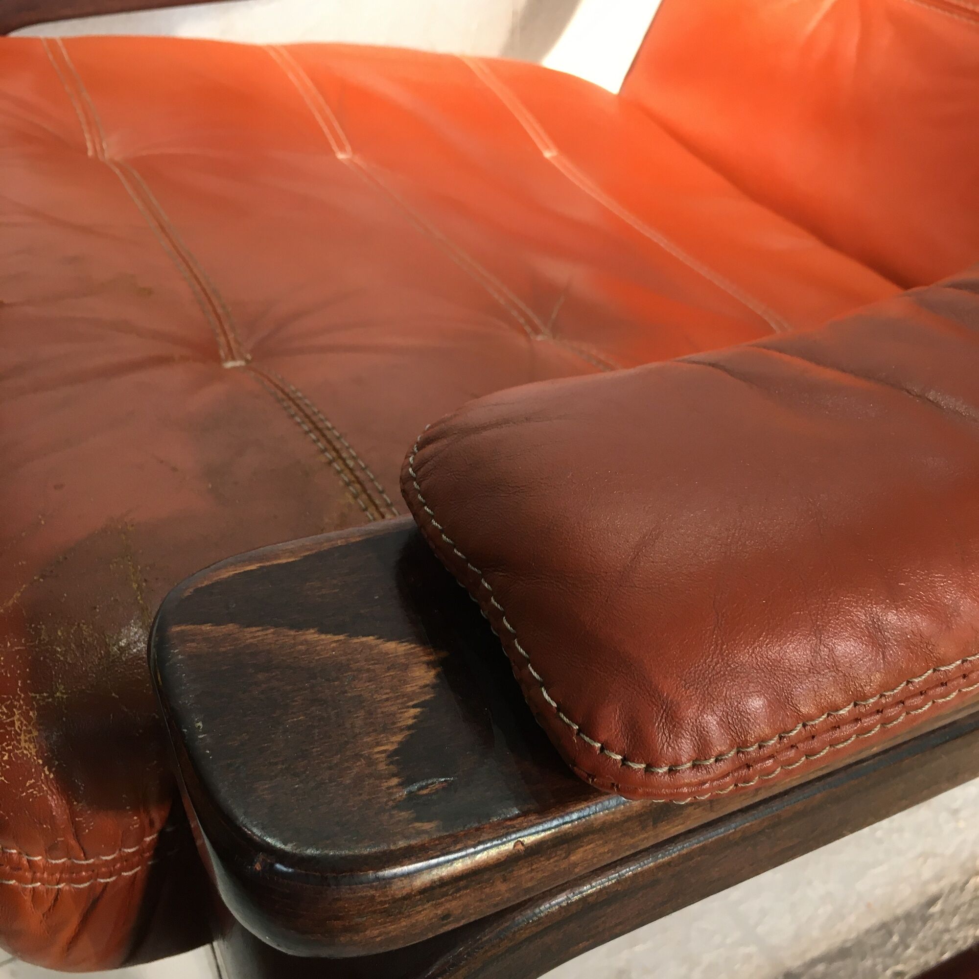 Duo of ochre leather and wood frame armchairs