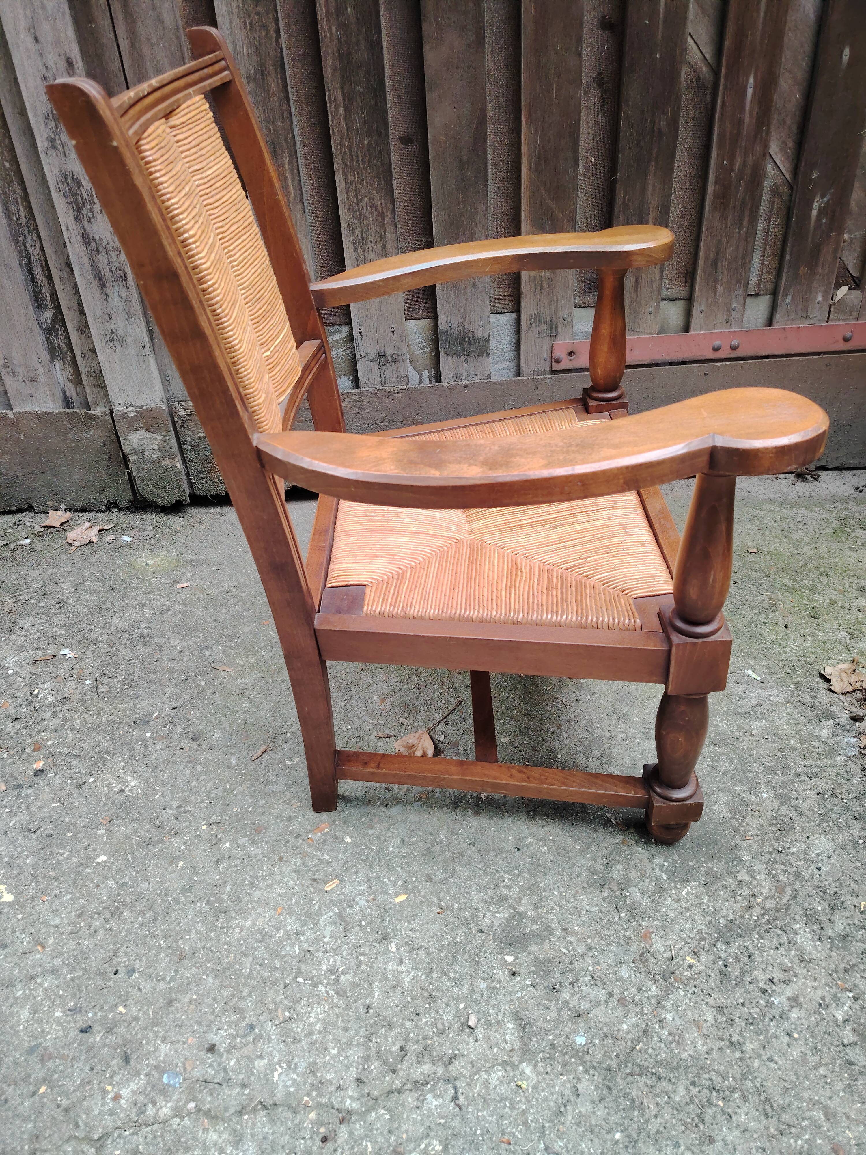 Solid wood and straw armchair