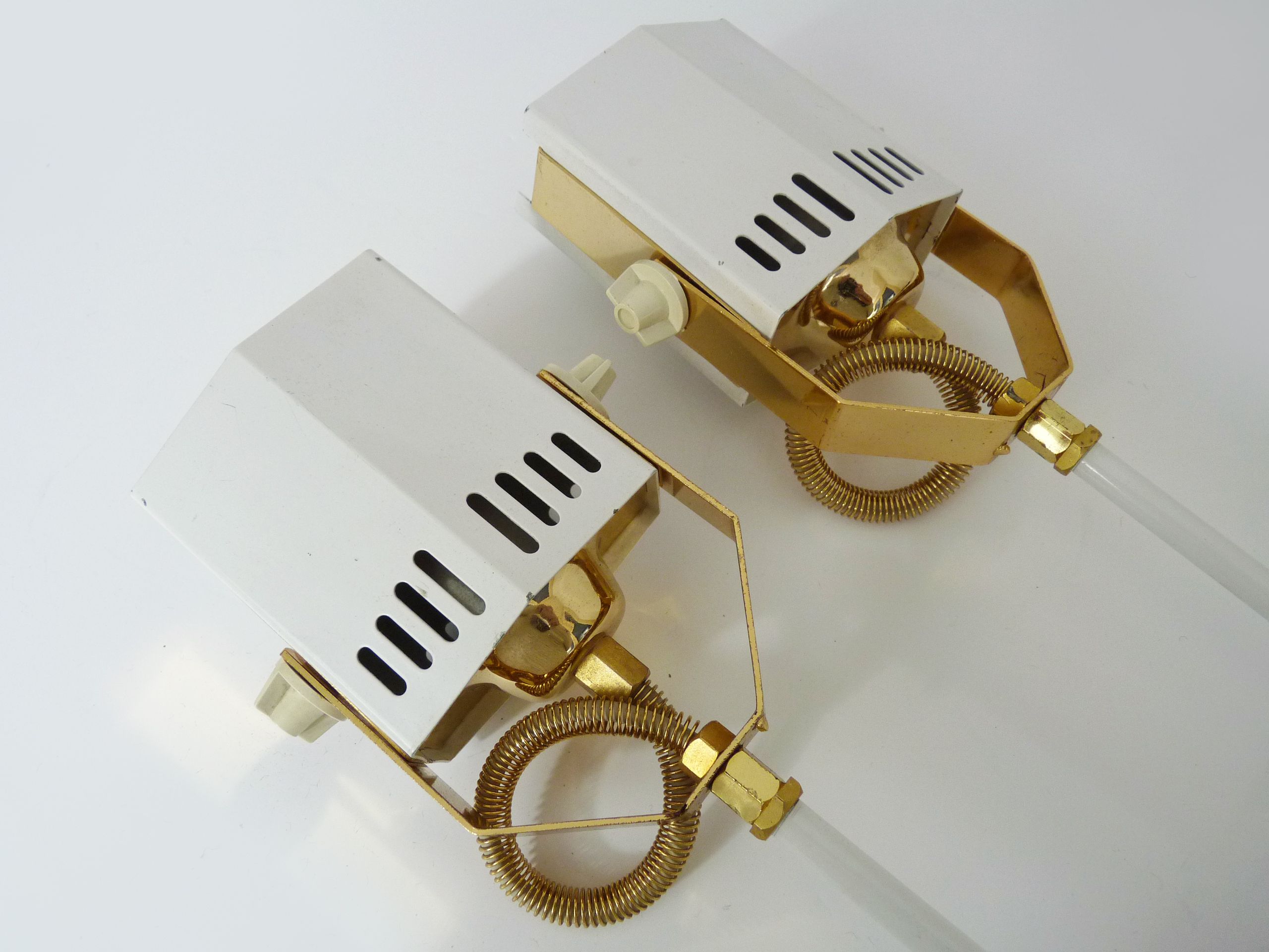 Pair of spot wall lamps adjustable design in white metal and brass. Year 80