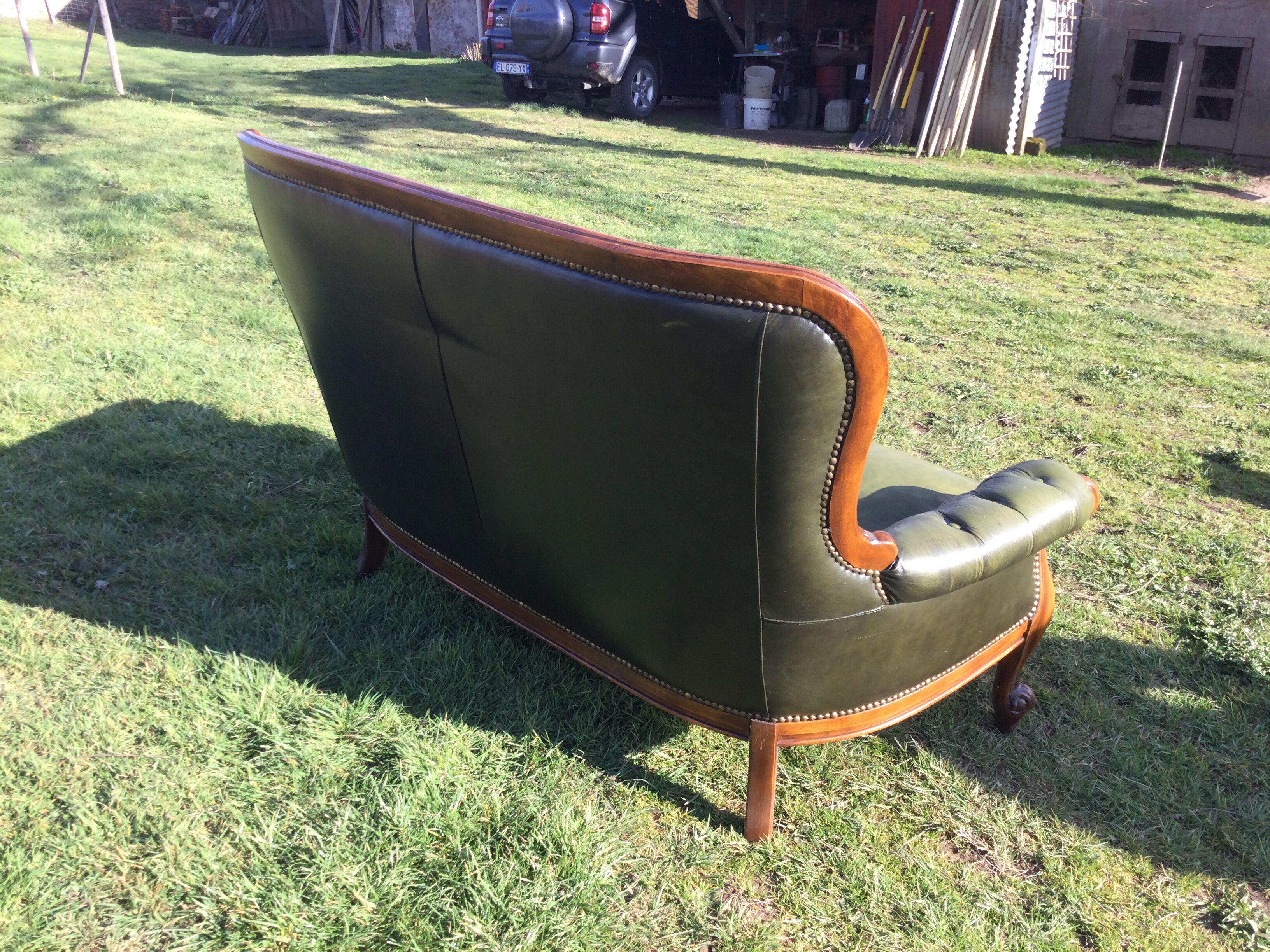 Wooden and leather chesterfield sofa
