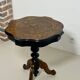 Two-tone black and mahogany pedestal table with mahogany veneer