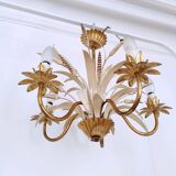 Vintage wrought iron chandelier decorated with golden and beige reeds