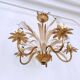 Vintage wrought iron chandelier decorated with golden and beige reeds