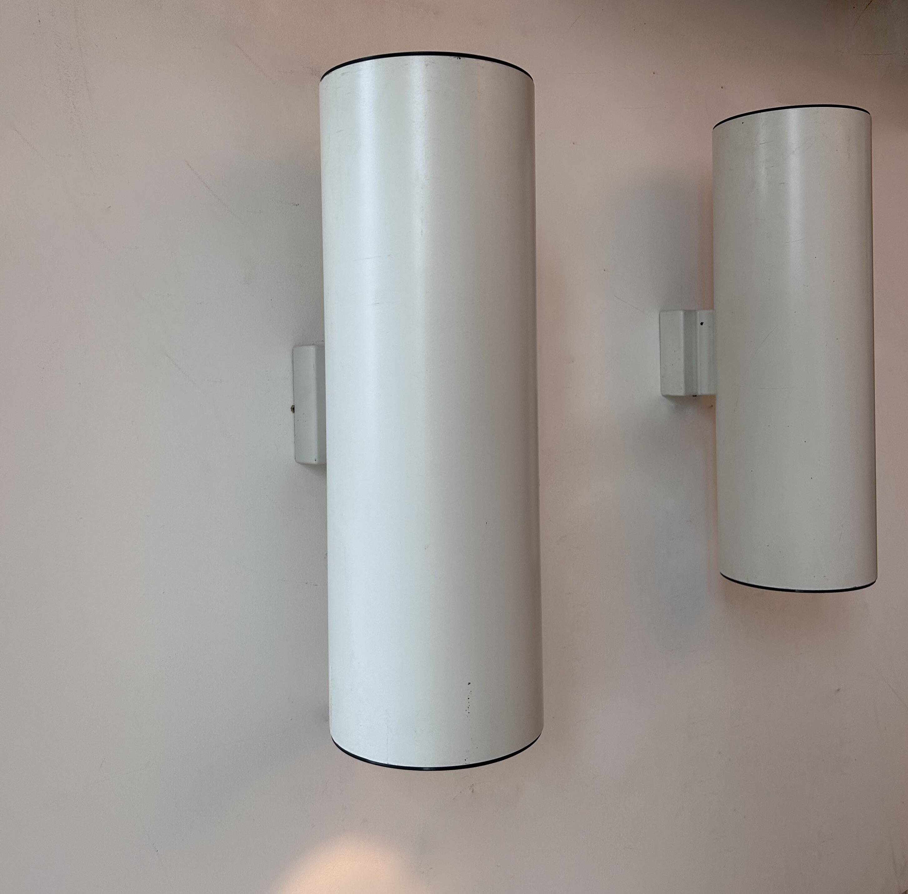 Pair of vintage cylindrical wall lights, matt white metal, Germany Erco 1976