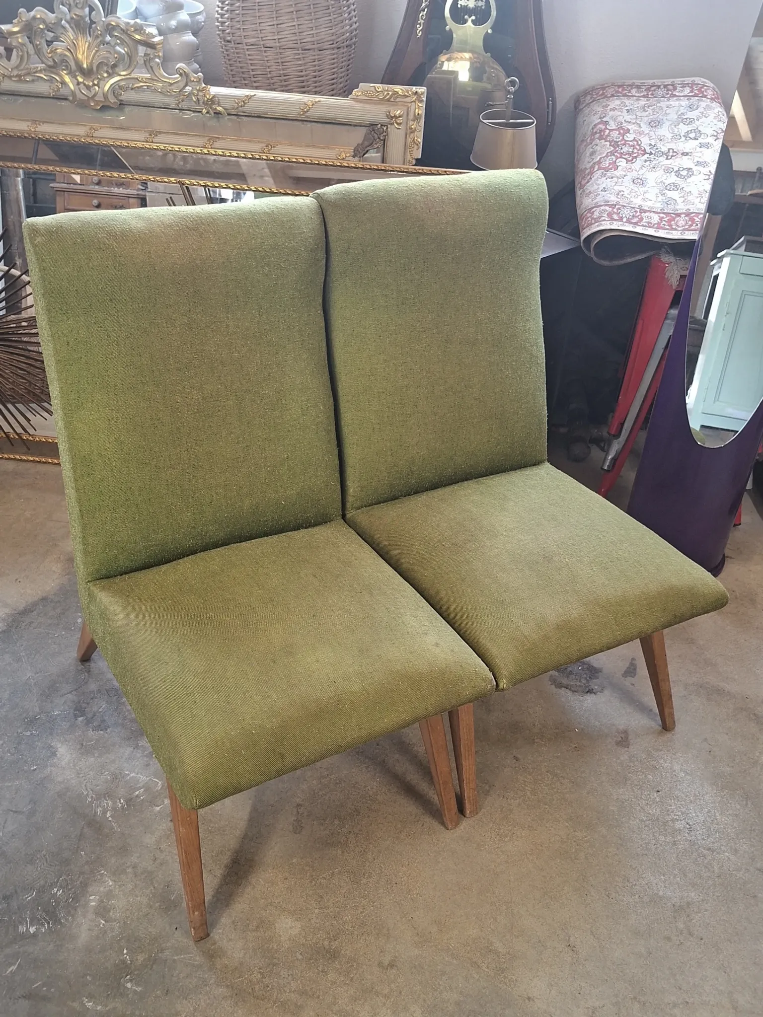 Pair of vintage armchairs with tapered legs from the 1950s.
