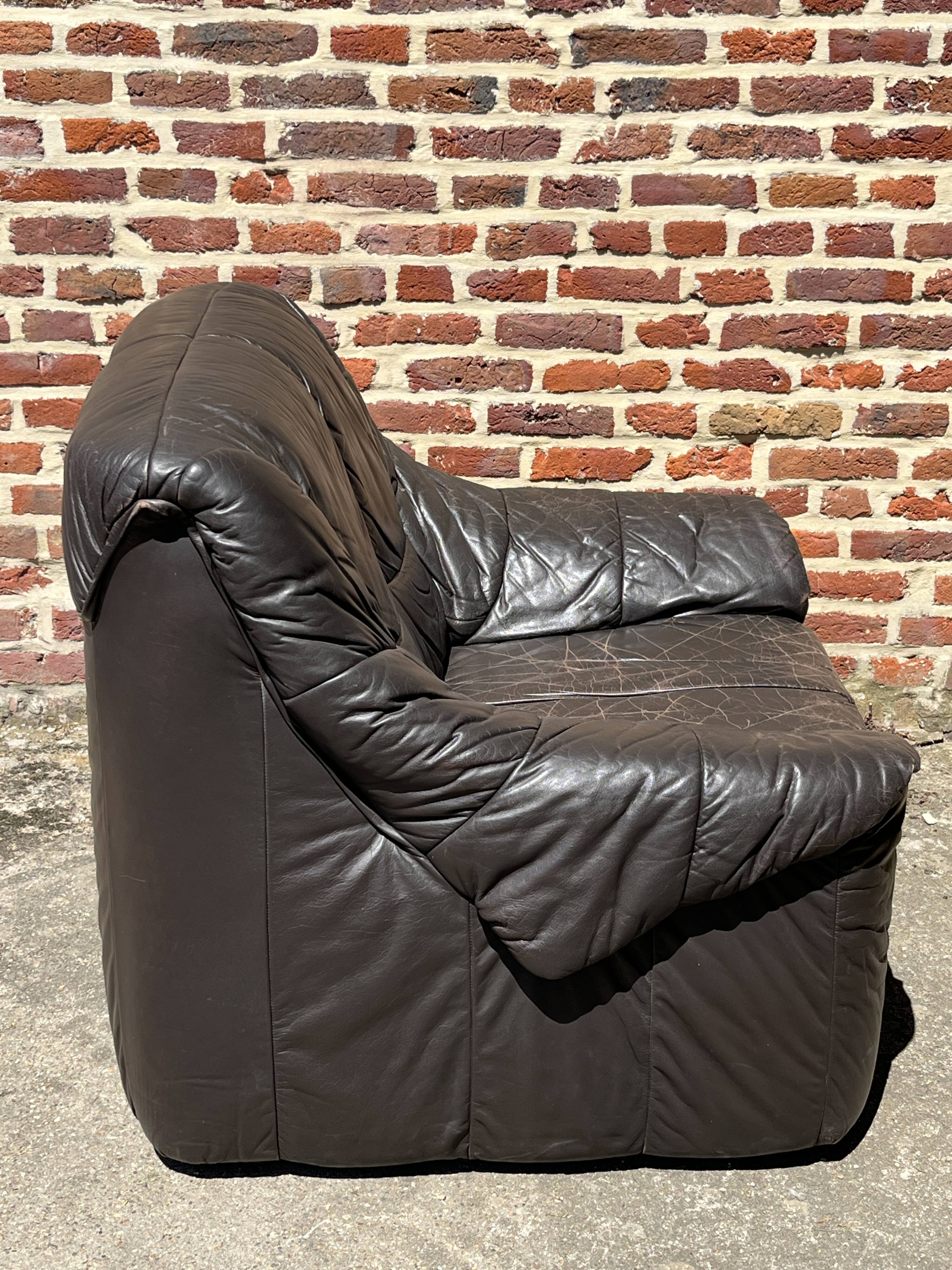 Pair of patinated leather club armchairs