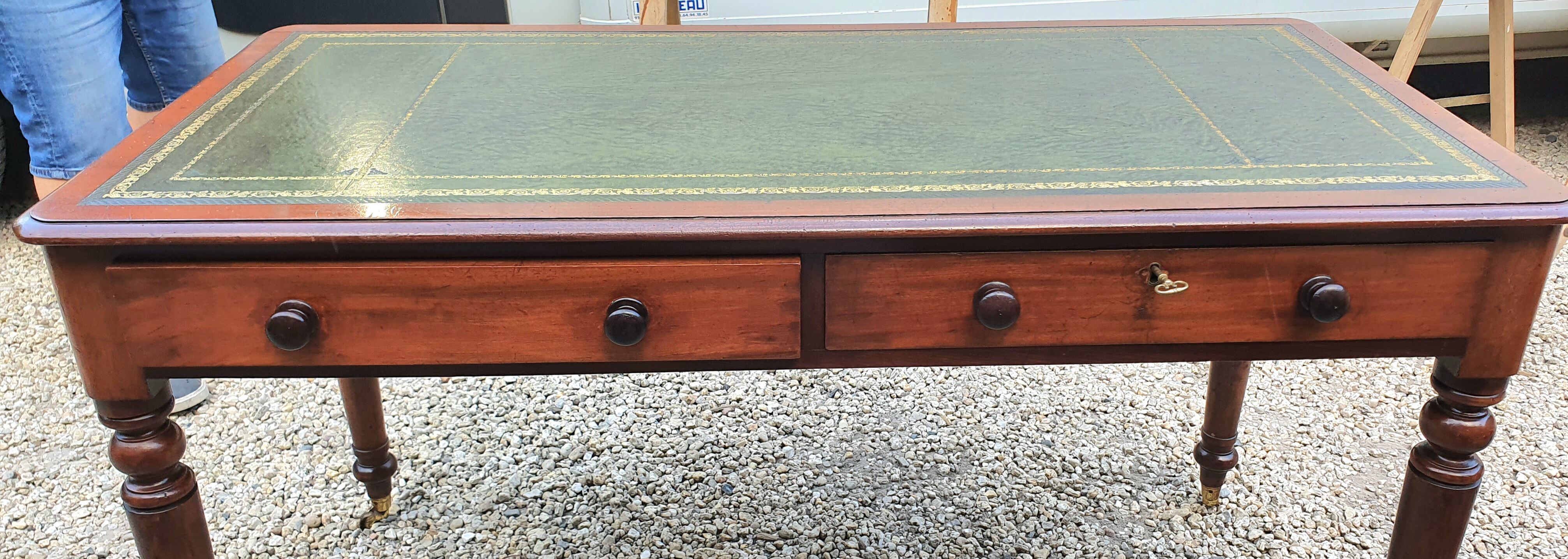 English desk with 2 drawers on green leather