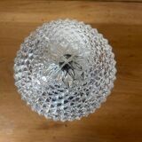 Diamond tip glass wall lamp in the shape of a bread apple.