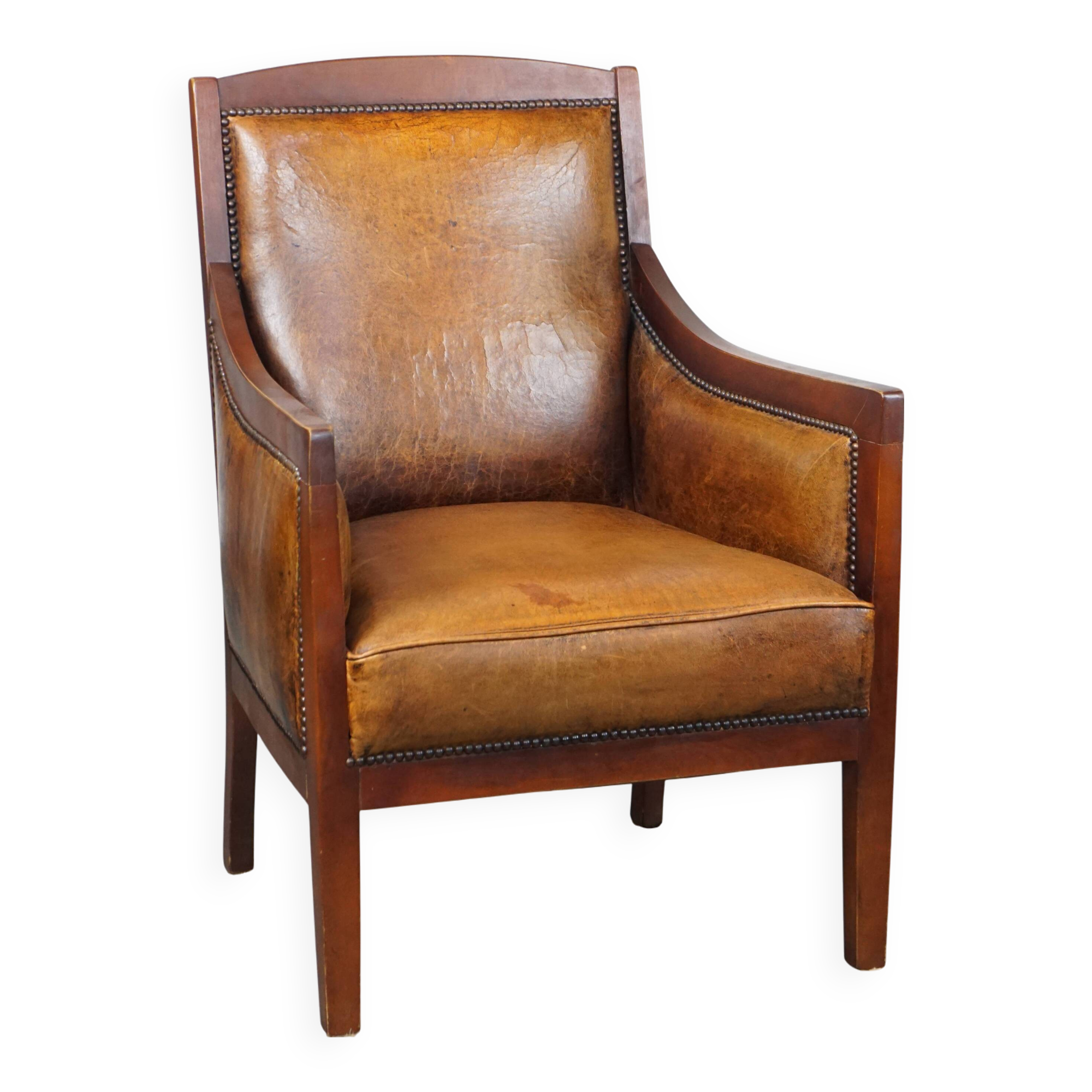 Sheepskin and wooden vintage Art Deco design armchair in a cognac color