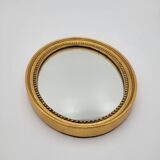 Small old oval mirror in gilded wood