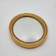 Small old oval mirror in gilded wood