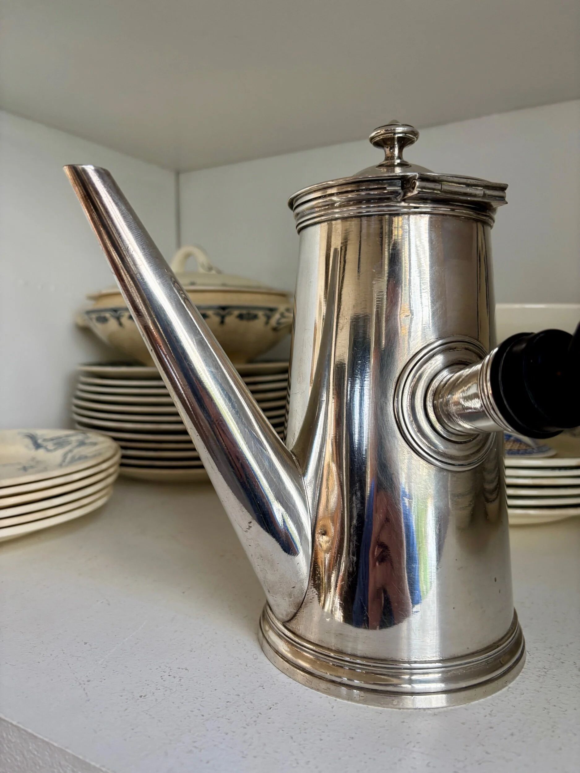 Christofle silver-plated chocolate pot and coffee pot with a blackened wooden handle.