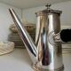 Christofle silver-plated chocolate pot and coffee pot with a blackened wooden handle.