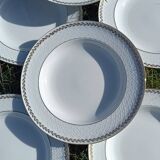 Twelve white porcelain plates