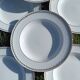 Twelve white porcelain plates