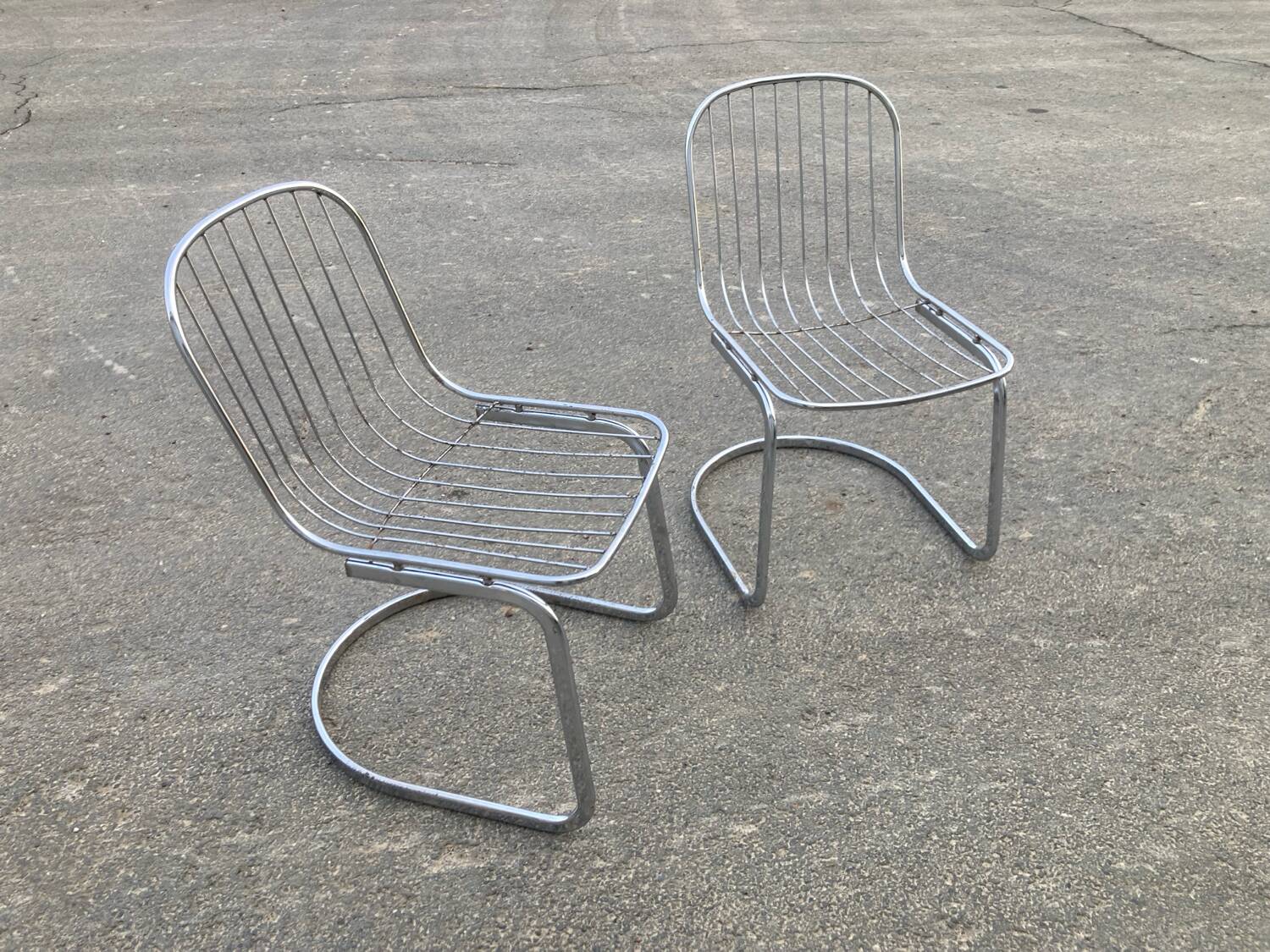 Two Gastone Rinaldi style chrome metal chairs.