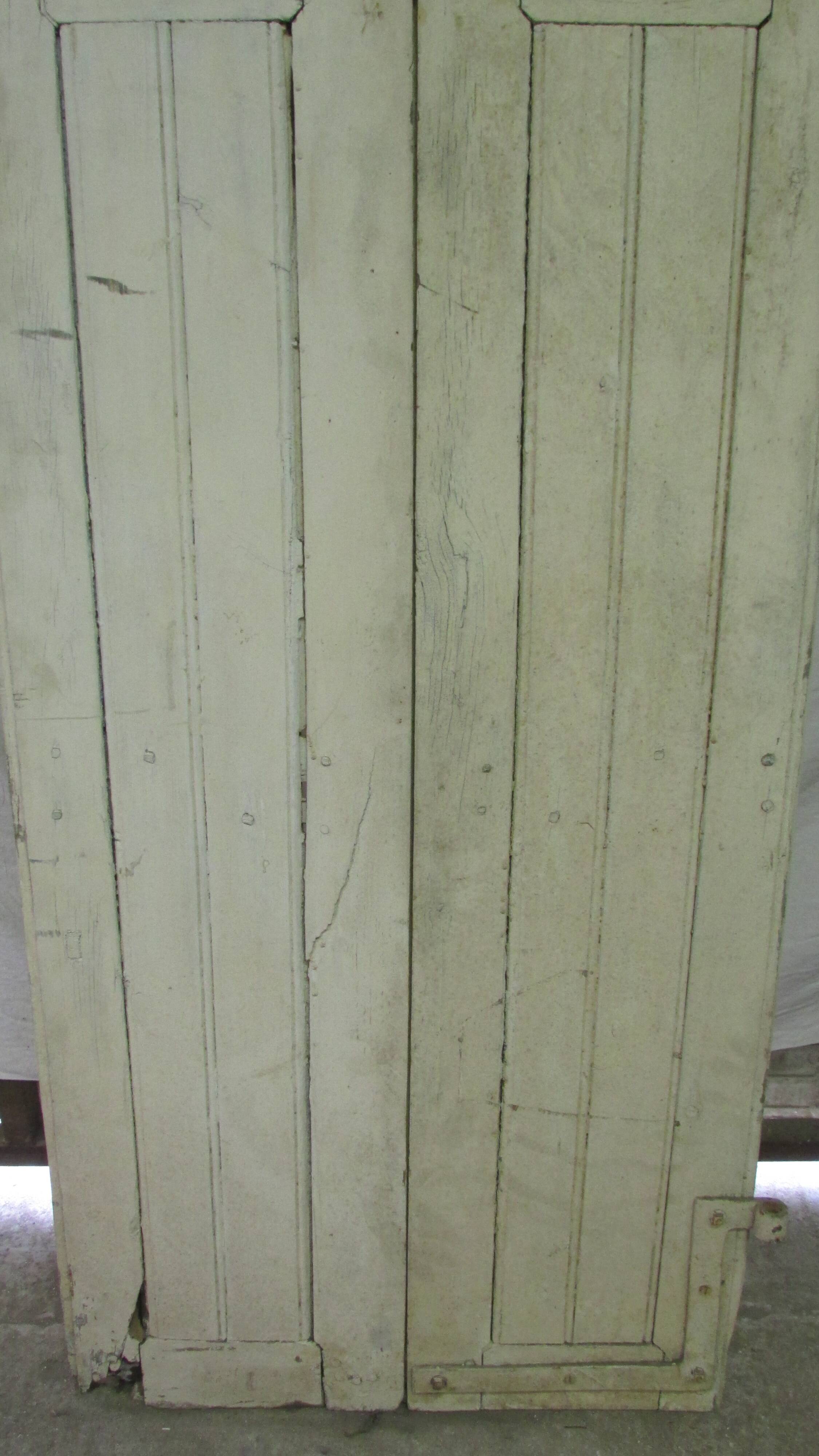 Old shutter in folding wooden louver