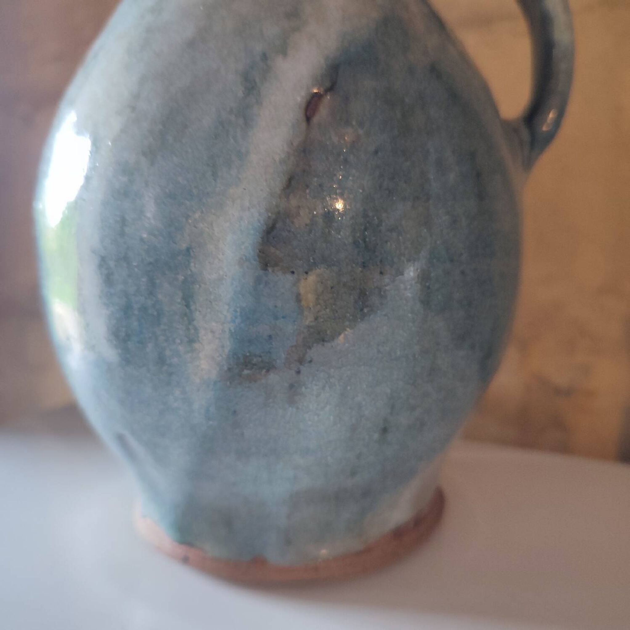 Blue crackle glaze stoneware pitcher