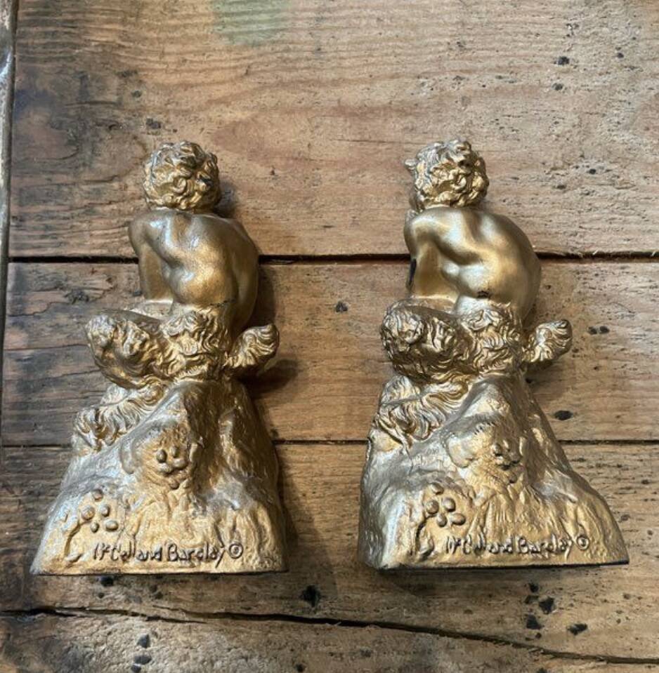 2 Seated satyr sculptures in cast bronze