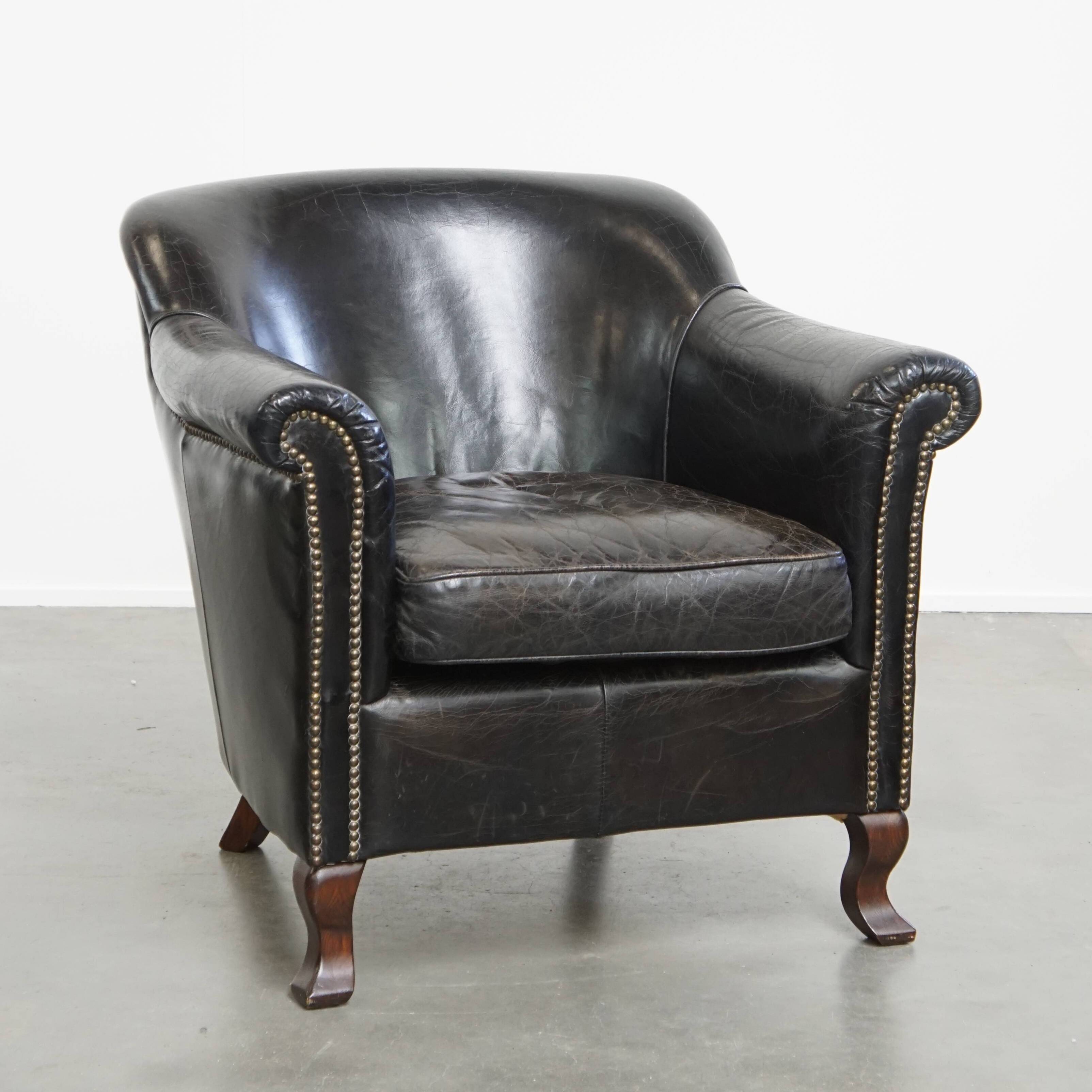 Black cowhide leather armchair