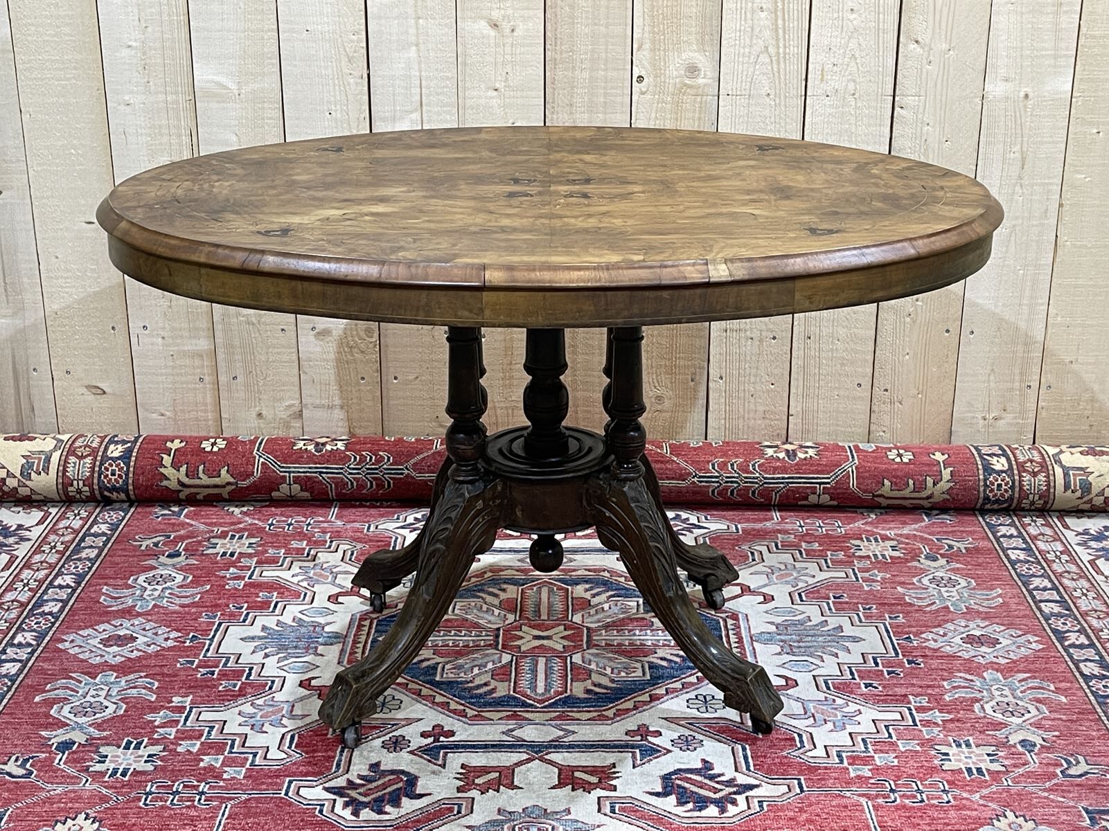 English guéridon from the late 19th century in walnut, ebony, and boxwood veneer.