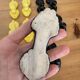 Box of 12 dog-shaped cutlery rests in yellow and black majolica.