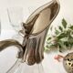 Ewer, decanter in silver-plated metal and glass