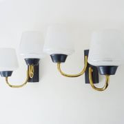 Pair of vintage Maison Arlus wall lights from the 1950s in brass, glass globe.
