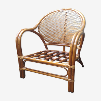 Low armchair in rattan and bamboo