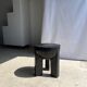 Black mango wood tripod side table with a semi-spherical top, height: 45 cm, diameter: 44 cm.