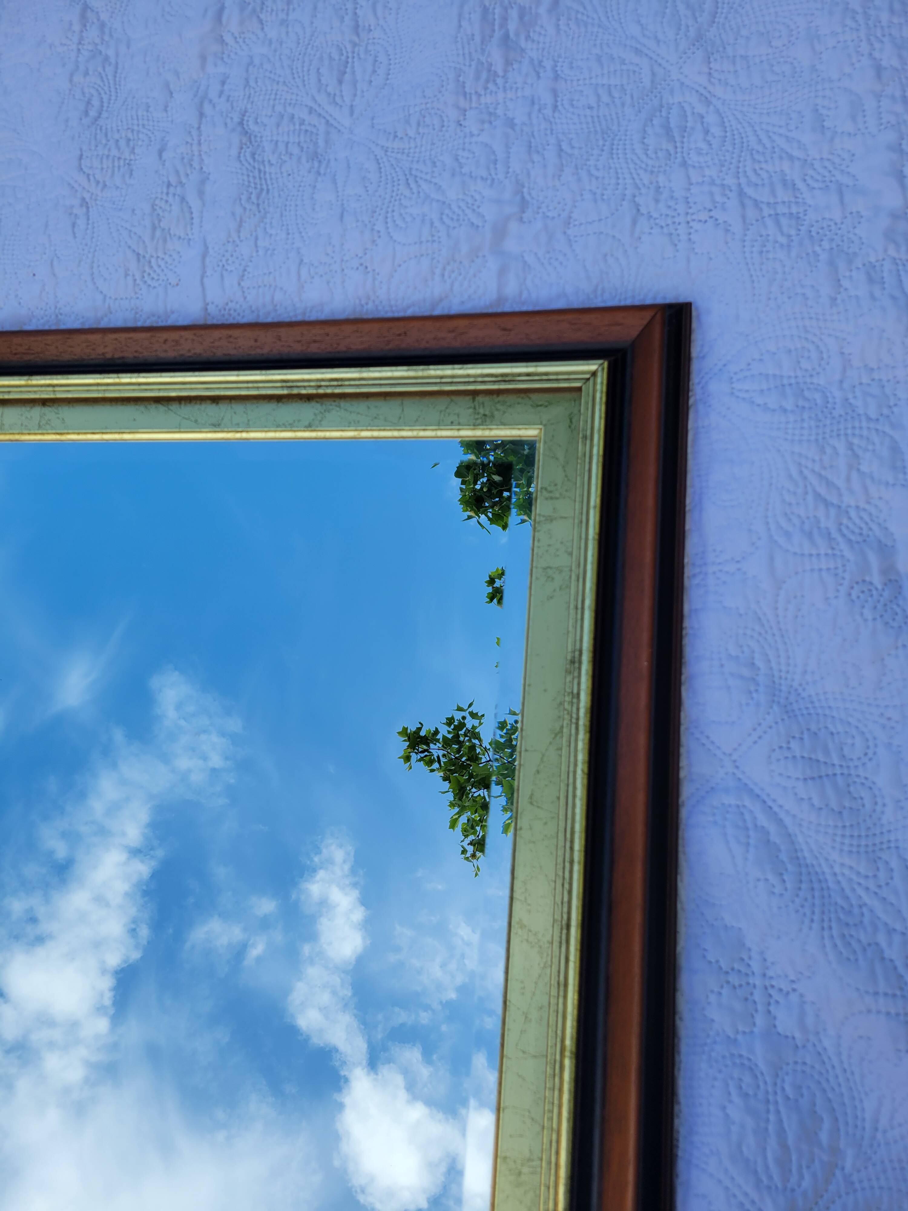 Large wooden and gold mirror