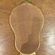 Golden wooden mirror in baroque style