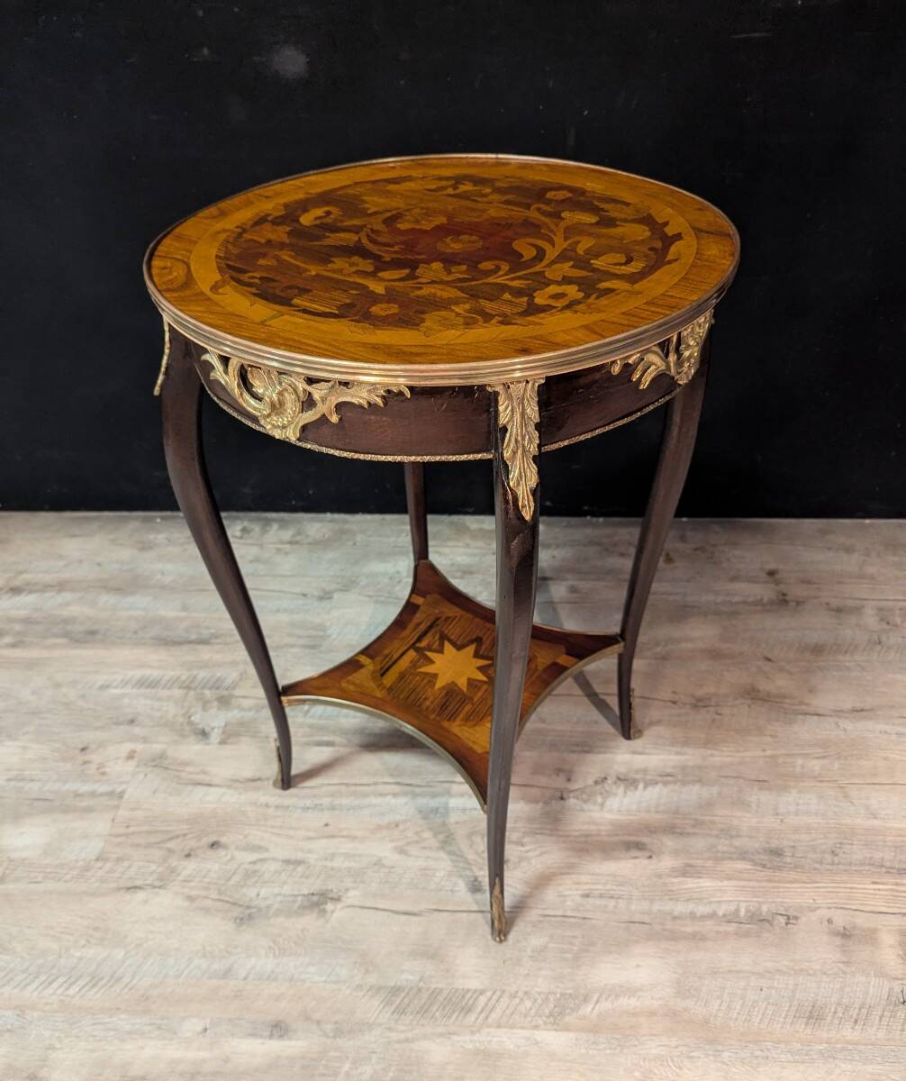 Louis XV style gueridon with floral marquetry.