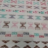 White carpet with multicolored Berber patterns handmade