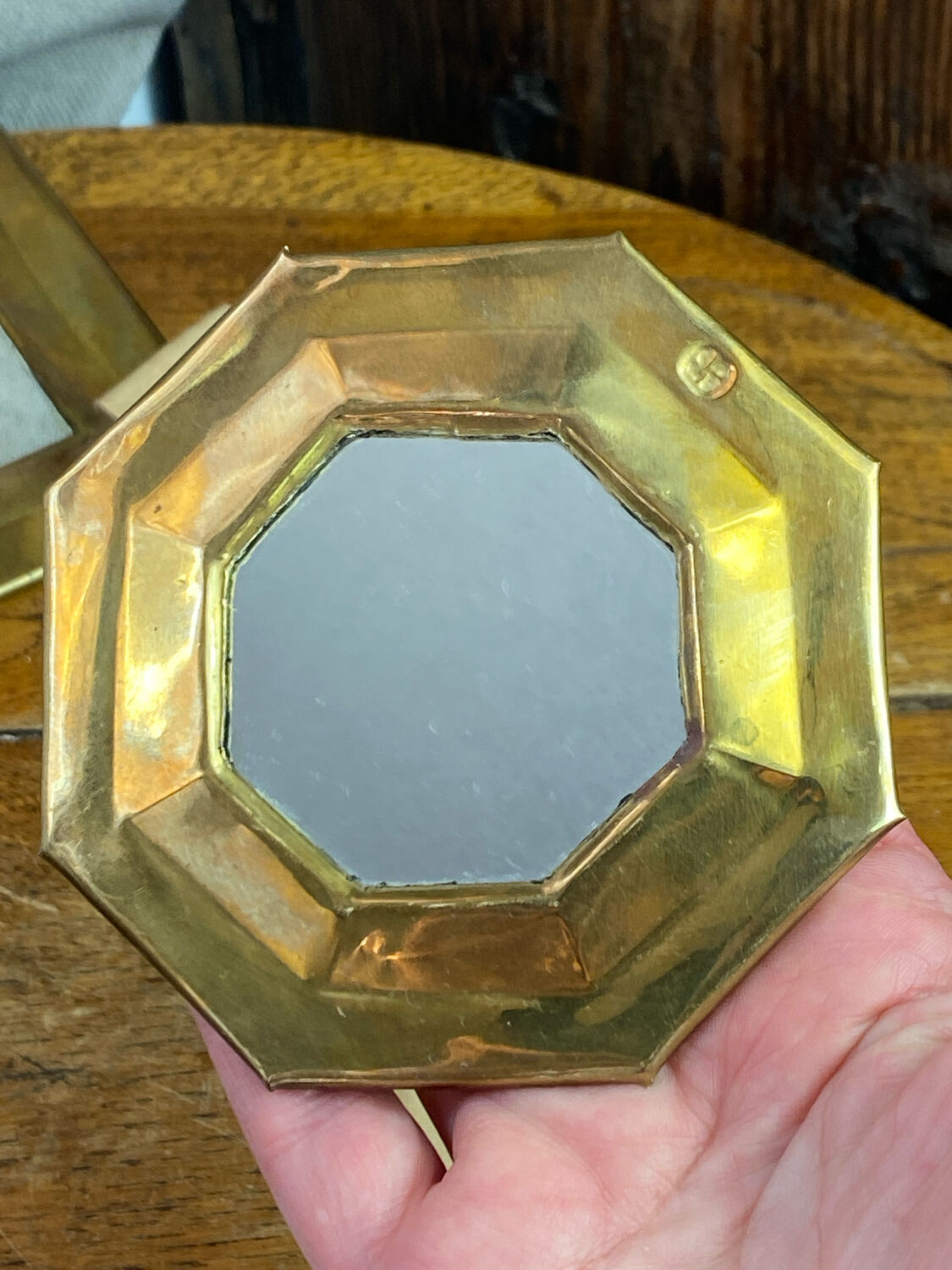 Set of five small wall mirrors in brass.