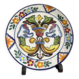 Decorative ceramic plate with griffins