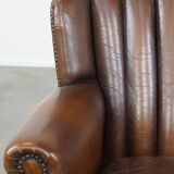 Sheep leather armchair finished with decorative nails