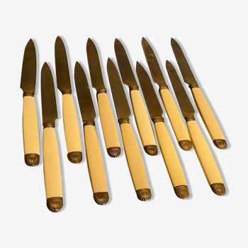 Suite of golden metal fruit knives with Louis XV style shell decoration