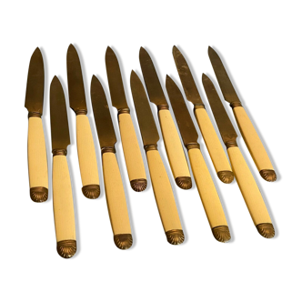 Suite of golden metal fruit knives with Louis XV style shell decoration