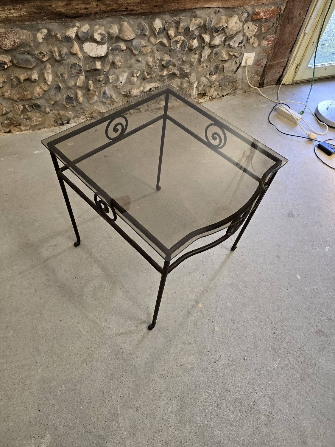 Small side table in wrought iron and smoked glass