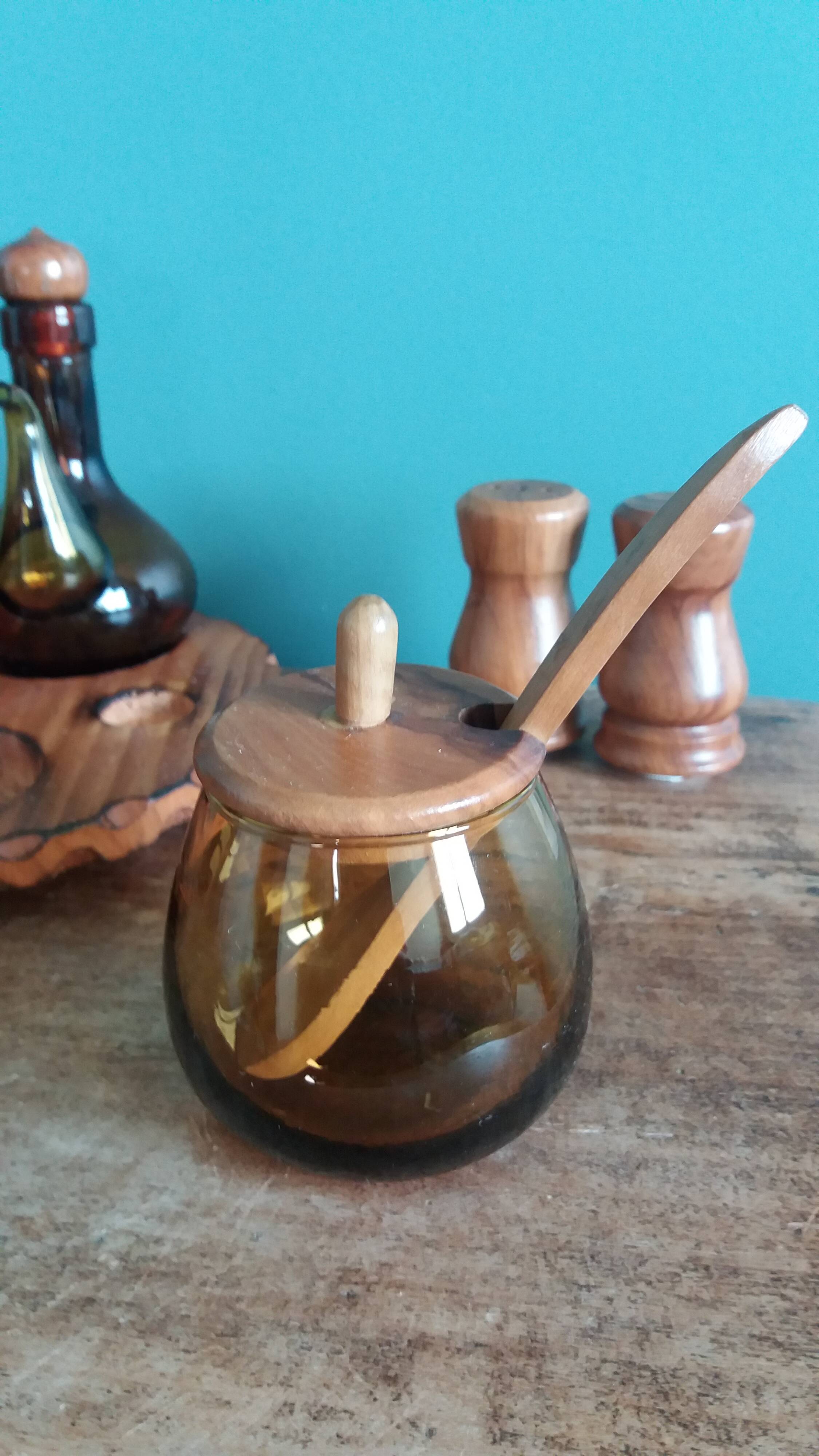 Oil, vinegar, mustard, pepper, salt, olive wood servant from Spain.