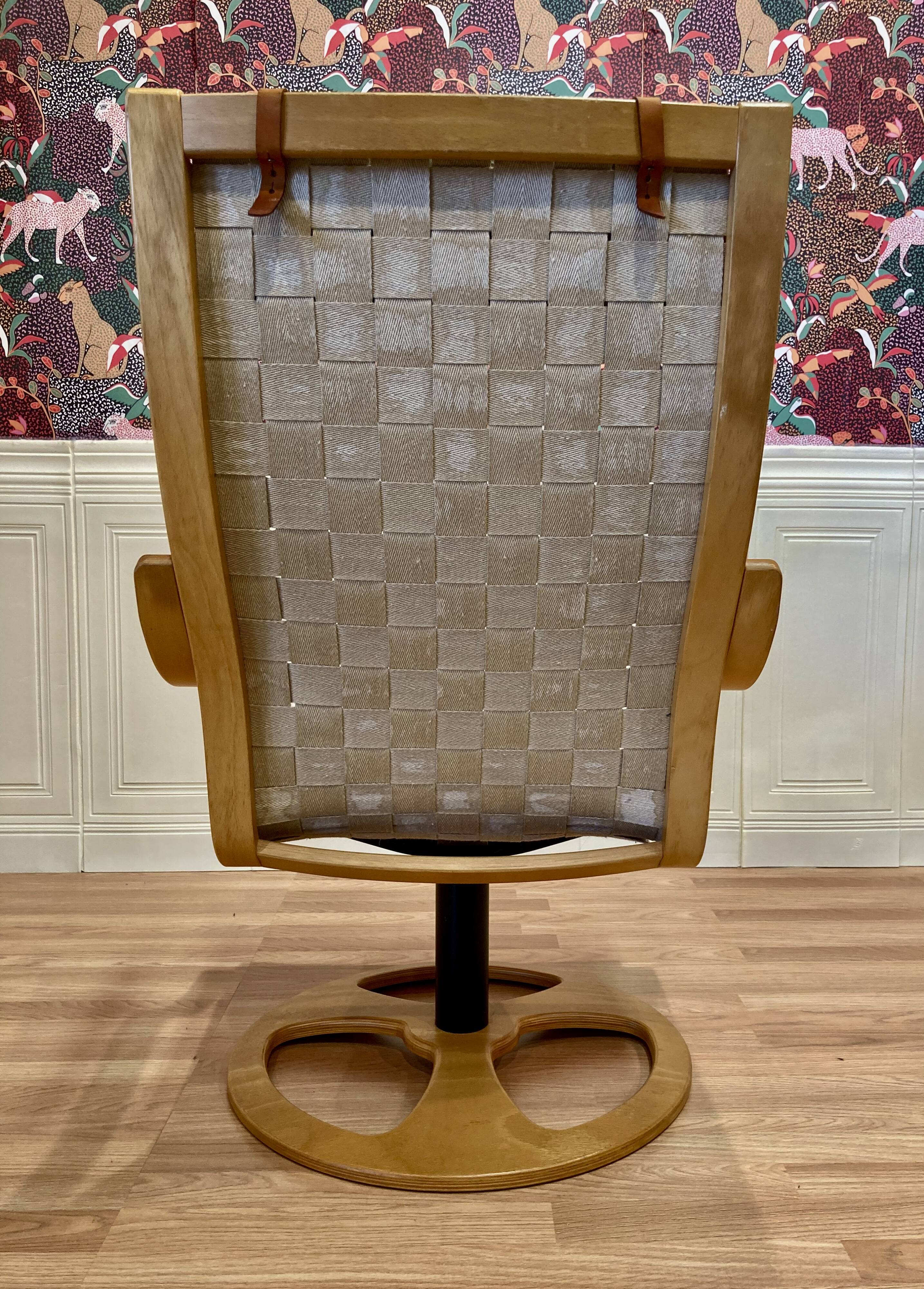 Swivel armchair and its ottoman in 1960s Scandinavian design.