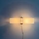 Simple white plexiglass wall light with a black metal frame, 1970s, Germany.