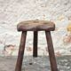 Vintage wooden tripod stool, mountain work, wabi-sabi, shepherd.
