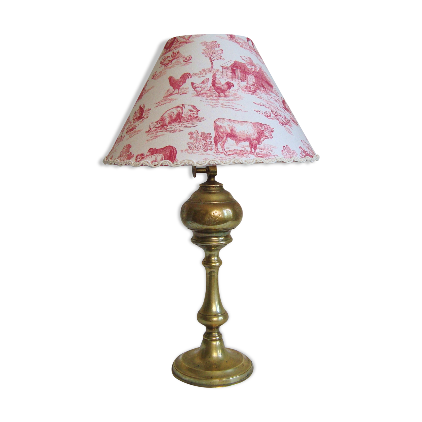 Ancient brass lamp with its youthd shade motifs farm animals