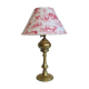 Ancient brass lamp with its youthd shade motifs farm animals
