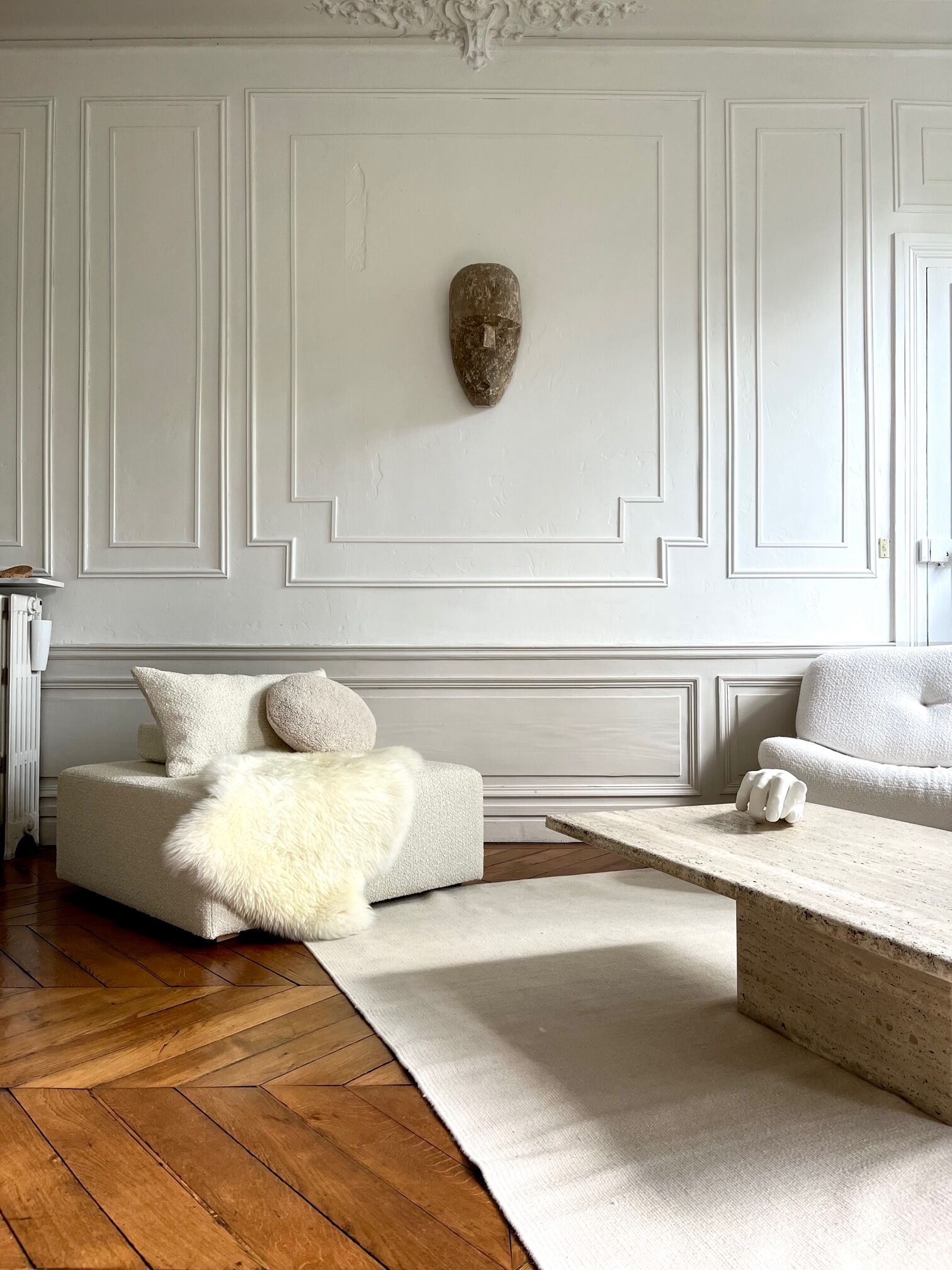 Square ottoman and its cushions in buckle fabric