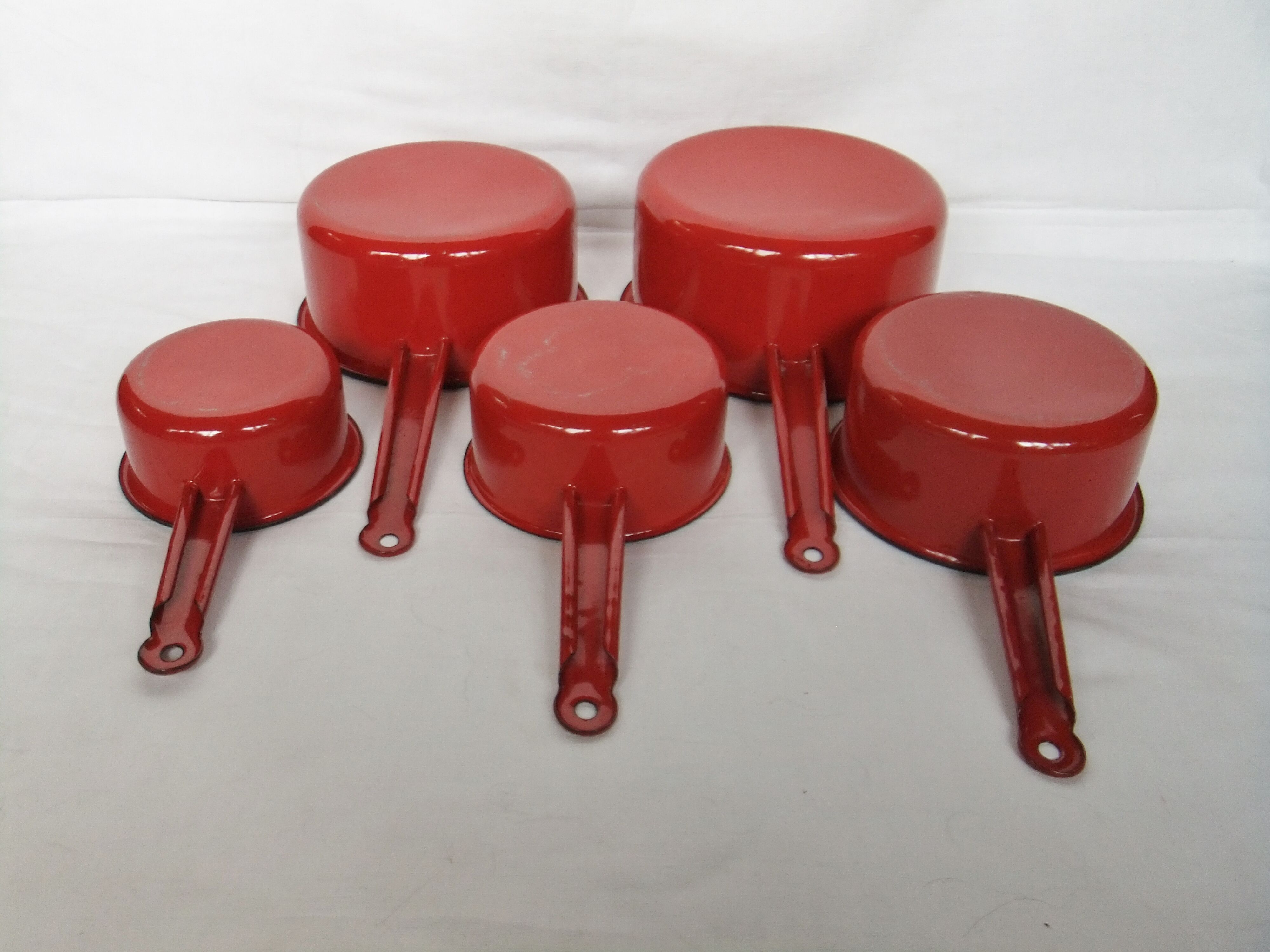 Red enamelled sheet metal pans