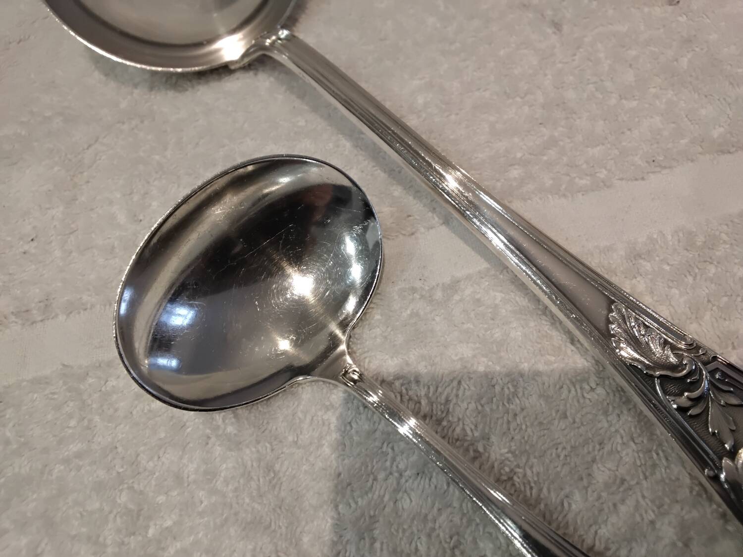 2 Silver-plated soup and sauce ladles with rocaille ribbon decoration