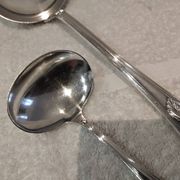 2 Silver-plated soup and sauce ladles with rocaille ribbon decoration
